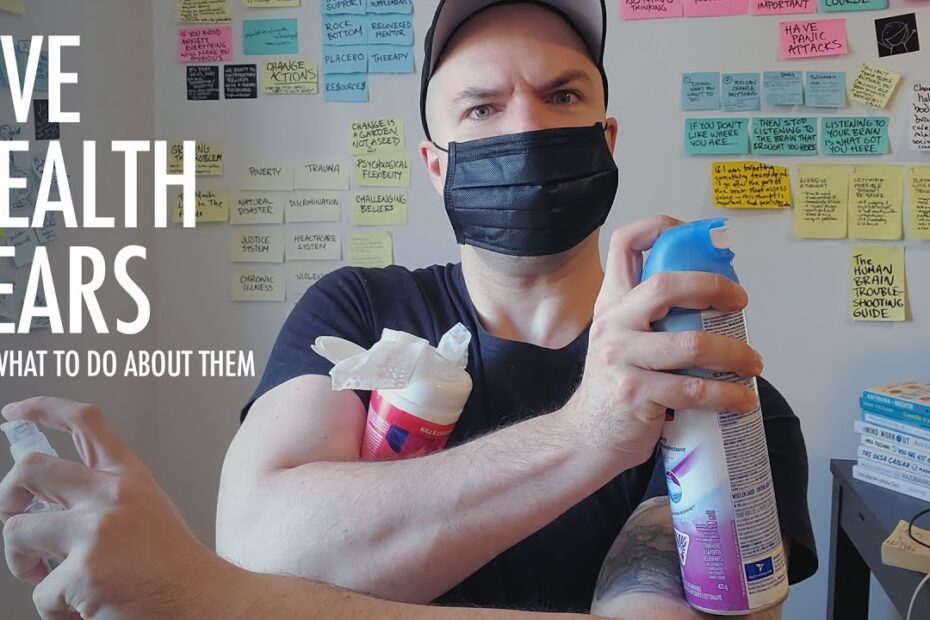 Image says: Five Health Fears and how to handle them. The words are beside a photo of Mark wearing a face mask, holding disinfectant spray in one arm that crosses his chest, pressing a container of wet wipes against him. His other arm is crossed under the disinfectant spray, holding a squeeze bottle of hand sanitizer, finger ready to press down on the bottle's dispenser. His eyes look concerned, one eyebrow raised.